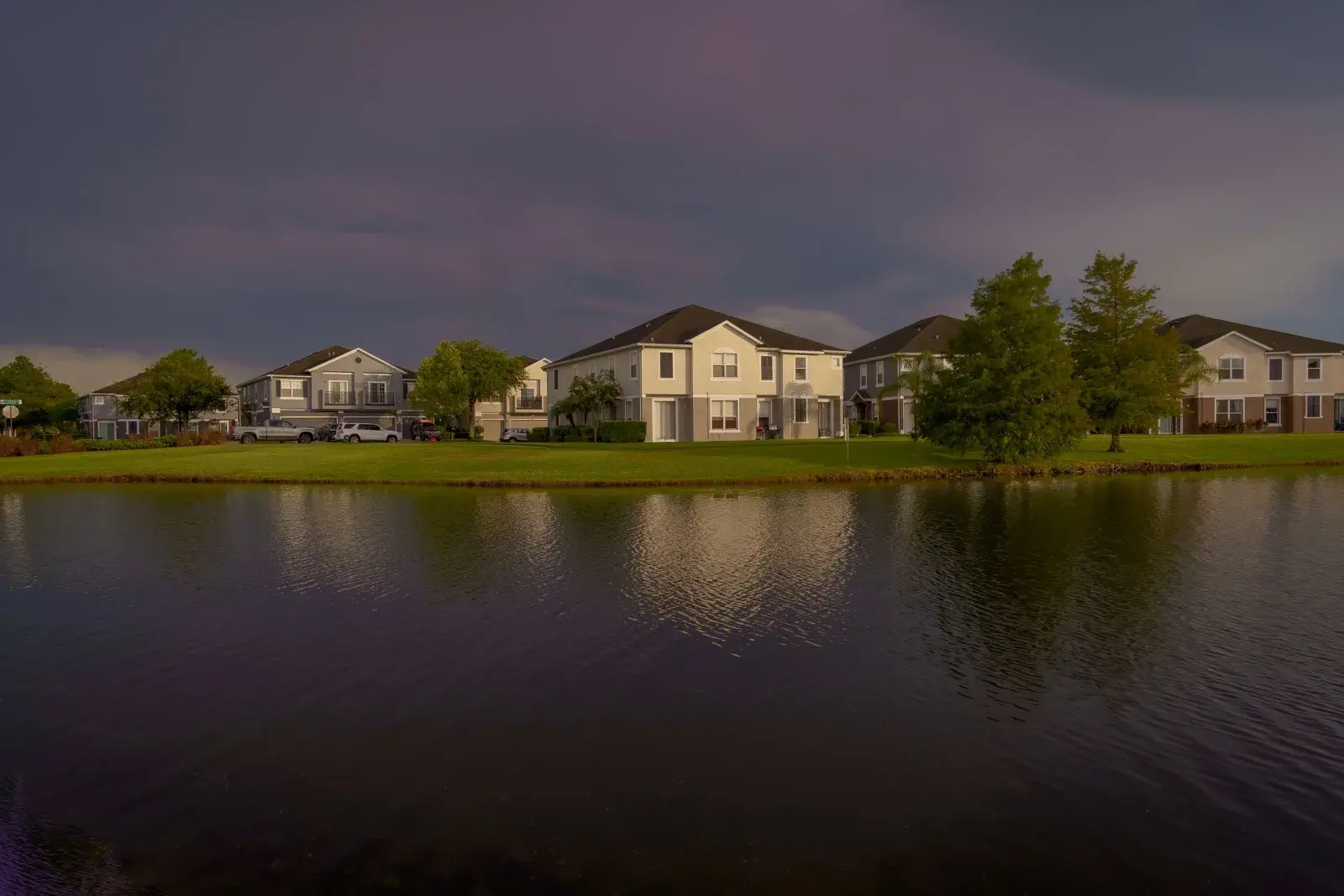 Waterfront Florida homes under a dramatic sky, representative of Cocoa, FL's Indian River frontage